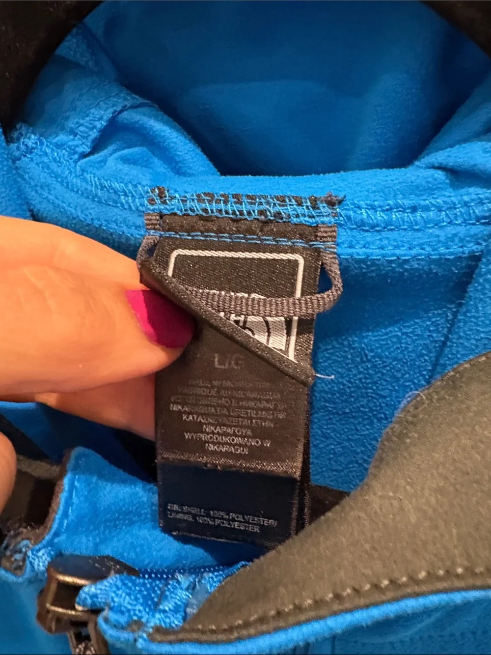The North Face men’s Blue Jacket with Black Chest Panel and many pockets